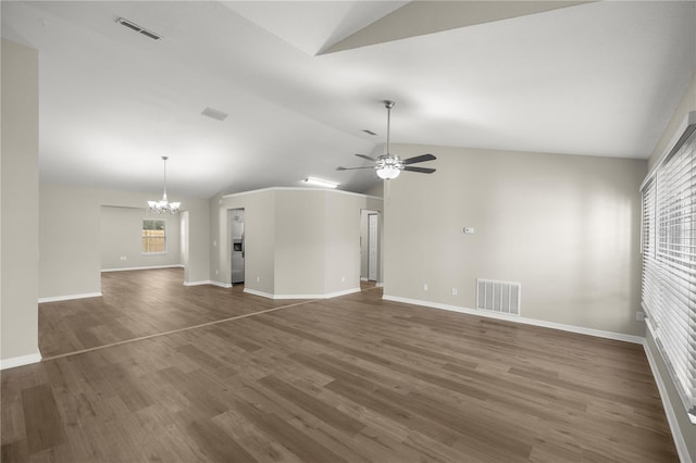 unfurnished living room with dark hardwood / wood-style floors, lofted ceiling, and ceiling fan with notable chandelier