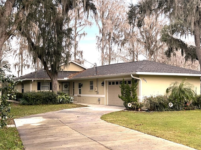 ranch-style house featuring a front yard and a garage