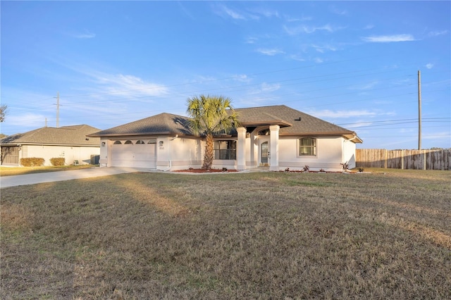 view of front of property with a garage and a front yard