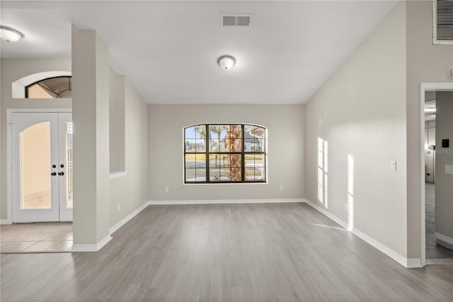 foyer with light hardwood / wood-style floors