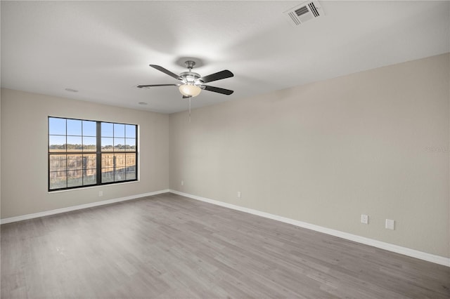 spare room featuring ceiling fan and wood-type flooring