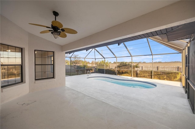 view of swimming pool featuring a lanai, ceiling fan, and a patio