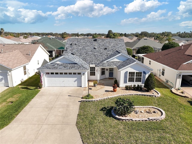 single story home with a garage and a front lawn