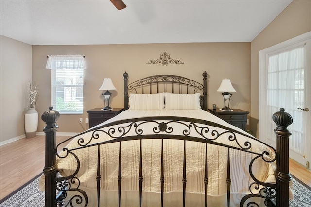 bedroom with ceiling fan and hardwood / wood-style floors