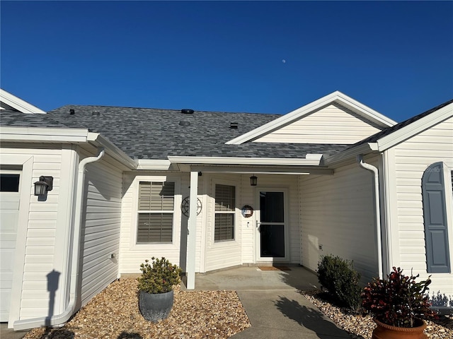 property entrance with a garage