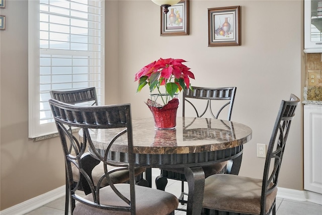 tiled dining area with plenty of natural light