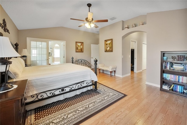 bedroom featuring vaulted ceiling, ceiling fan, and light wood-type flooring