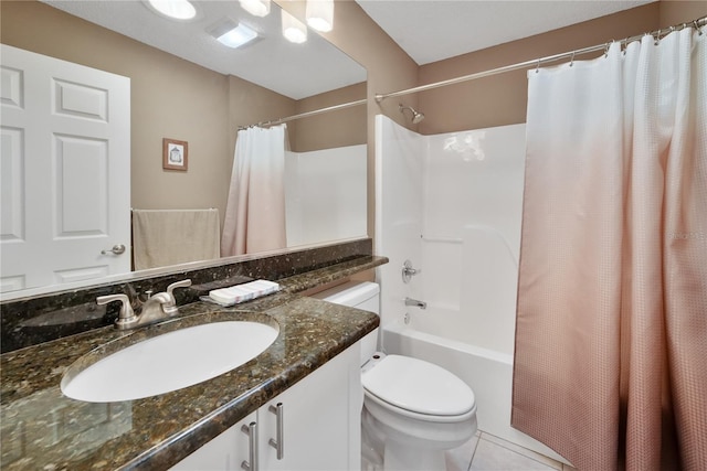 full bathroom featuring tile patterned flooring, vanity, shower / bath combo, and toilet