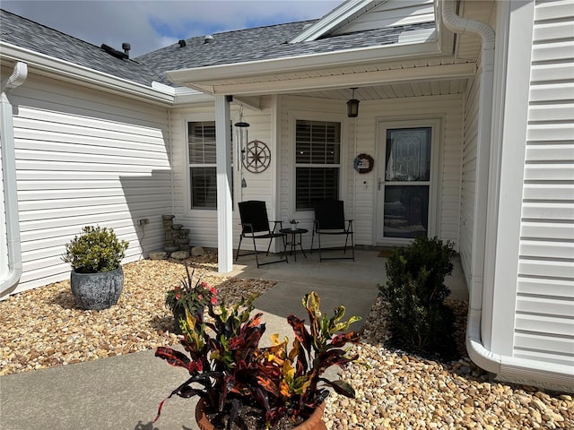 view of exterior entry featuring a patio