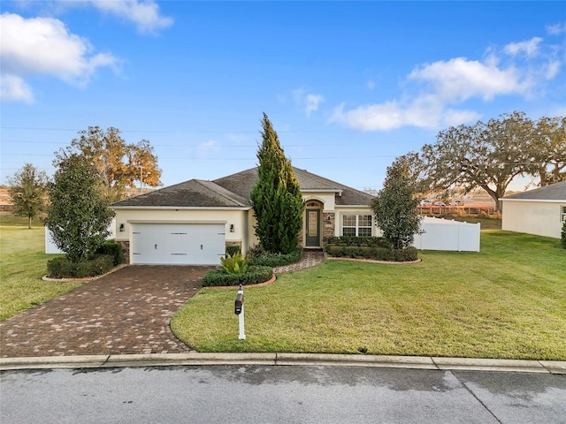 single story home with a front lawn and a garage