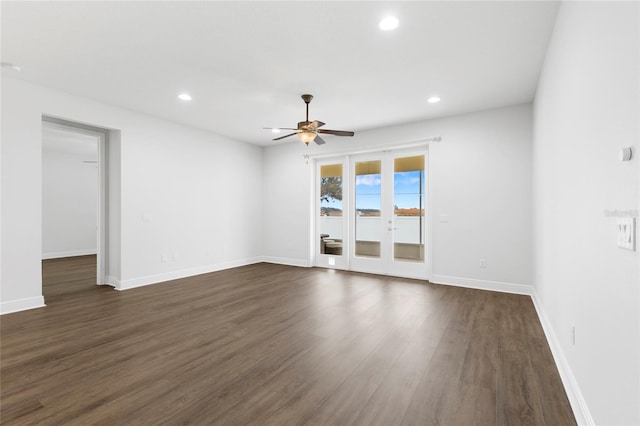 unfurnished room with ceiling fan and dark hardwood / wood-style flooring