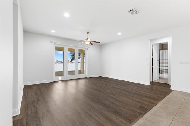 spare room featuring hardwood / wood-style flooring and ceiling fan