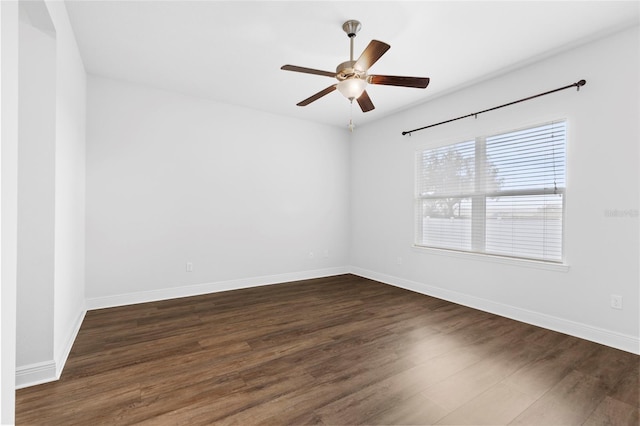 empty room featuring dark hardwood / wood-style floors and ceiling fan