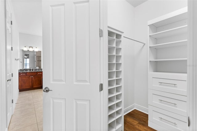 spacious closet featuring light tile patterned flooring