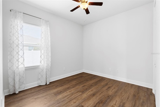 spare room featuring hardwood / wood-style floors and ceiling fan