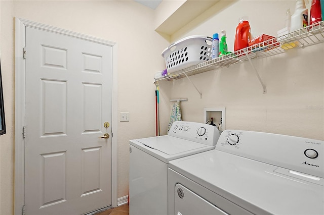 laundry area with washing machine and dryer