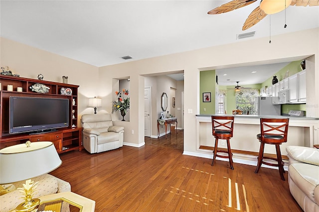 living room with dark hardwood / wood-style flooring