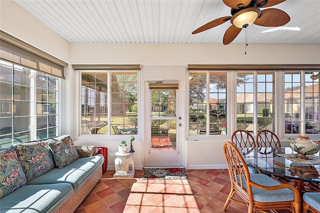 sunroom with ceiling fan and a healthy amount of sunlight