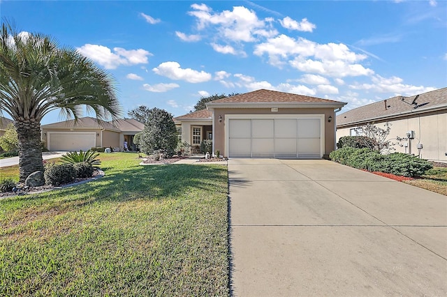 view of front of home with a front lawn and a garage