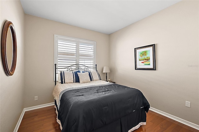 bedroom featuring dark wood-type flooring