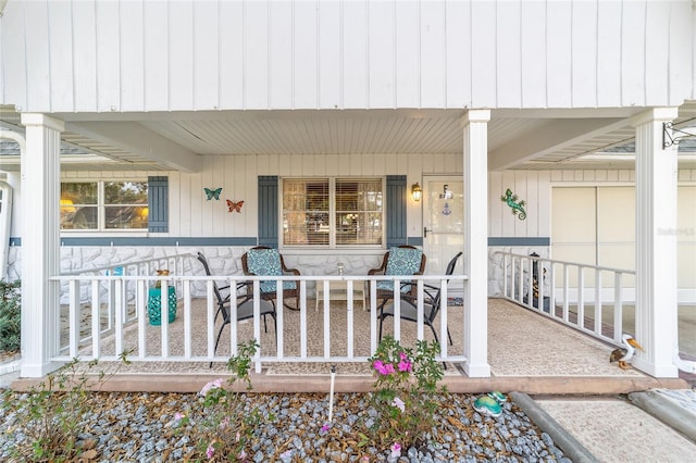 property entrance with covered porch