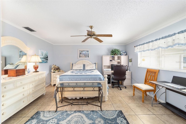 bedroom featuring a textured ceiling, ceiling fan, crown molding, and light tile patterned flooring