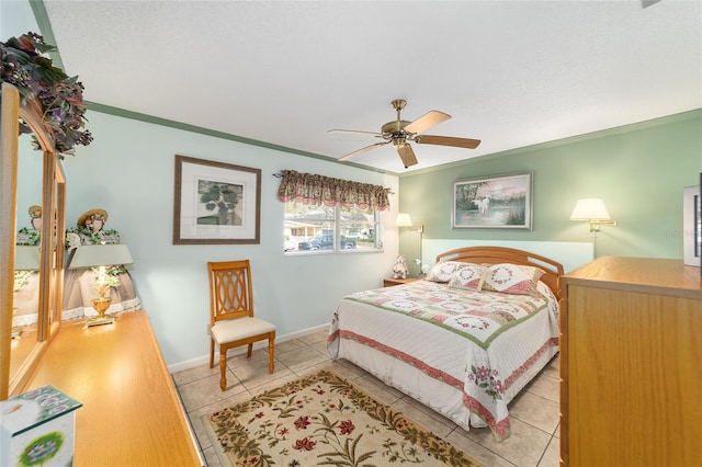 bedroom featuring ceiling fan, light tile patterned flooring, and ornamental molding