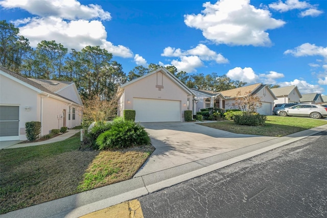 single story home with a garage and a front lawn