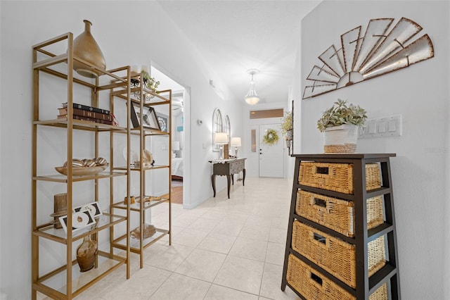 hallway featuring light tile patterned floors