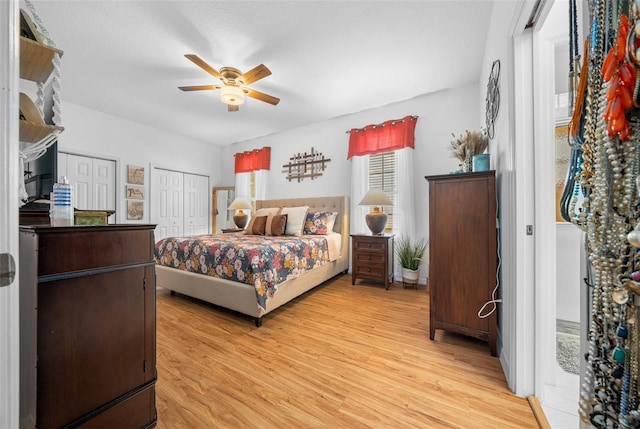 bedroom featuring light wood-type flooring and ceiling fan