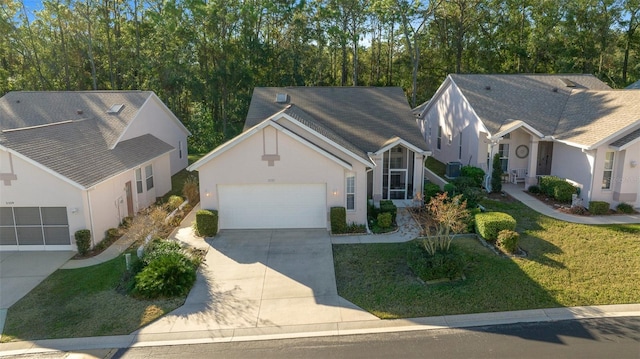 view of front of property with a garage and a front lawn