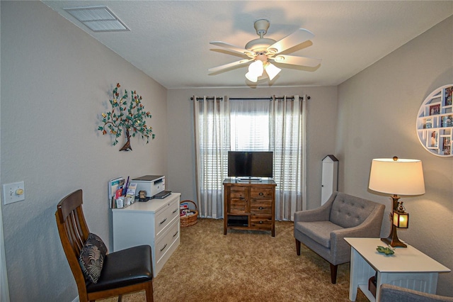 living area featuring ceiling fan and light carpet