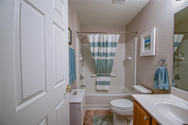 full bathroom with a textured ceiling, vanity, shower / tub combo, and toilet