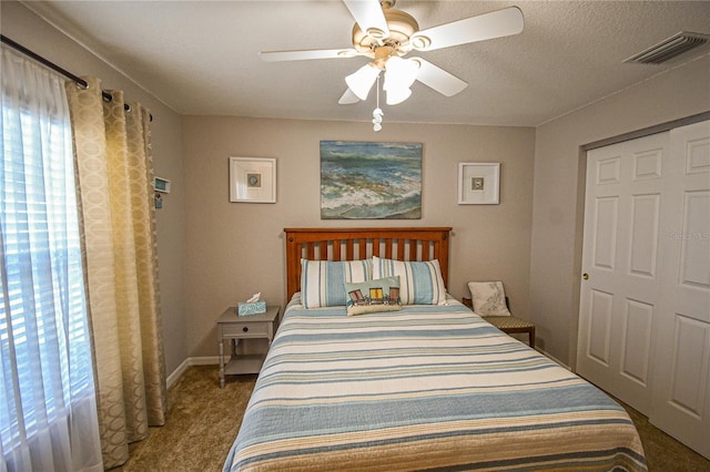 bedroom with carpet floors, a closet, and ceiling fan