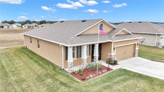 craftsman-style home with a garage and a front yard