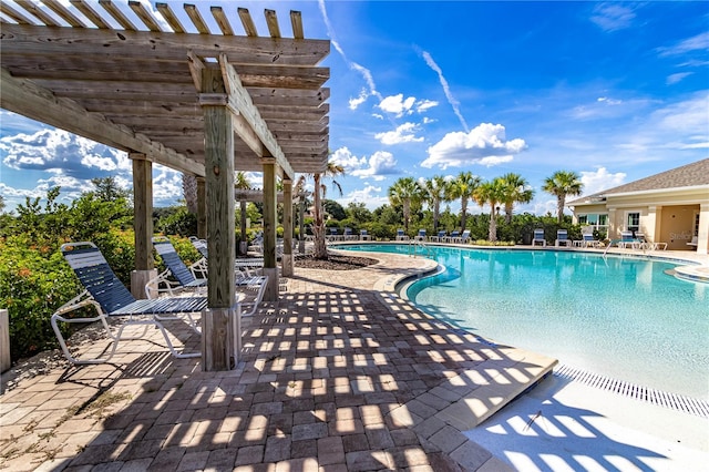 view of swimming pool featuring a pergola and a patio area