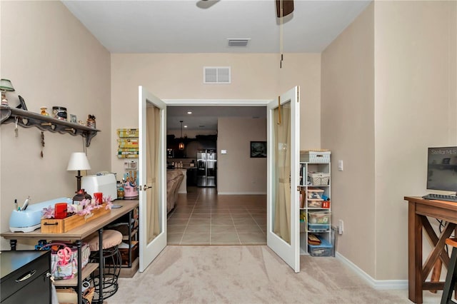 corridor featuring french doors and light tile patterned floors