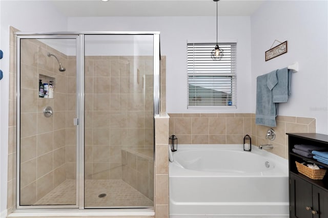 bathroom with separate shower and tub