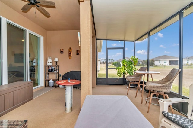 sunroom with ceiling fan and a wealth of natural light