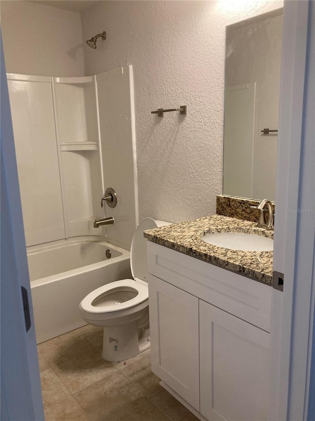 full bathroom with shower / washtub combination, vanity, and toilet