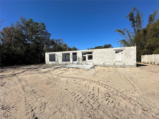 rear view of property featuring a patio