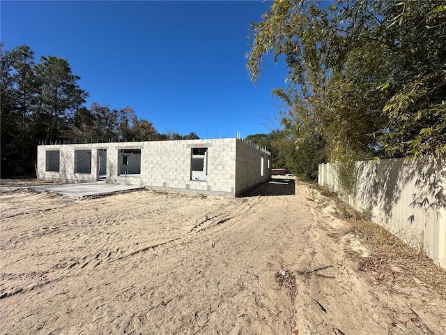 rear view of property featuring a patio area