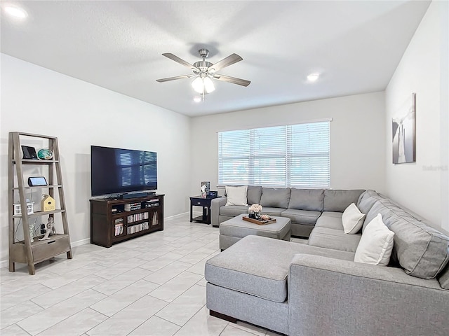 living room featuring ceiling fan and light tile patterned flooring