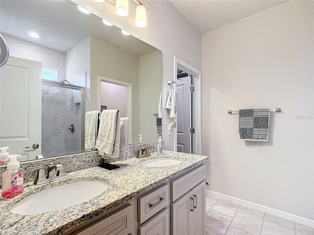 bathroom featuring tile patterned floors, vanity, and a shower with shower door