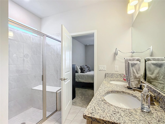 bathroom featuring tile patterned floors, vanity, and an enclosed shower