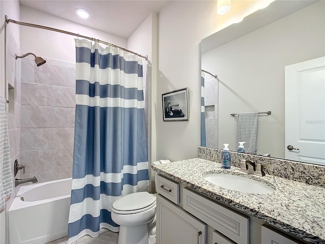 full bathroom featuring shower / bath combo, toilet, and vanity