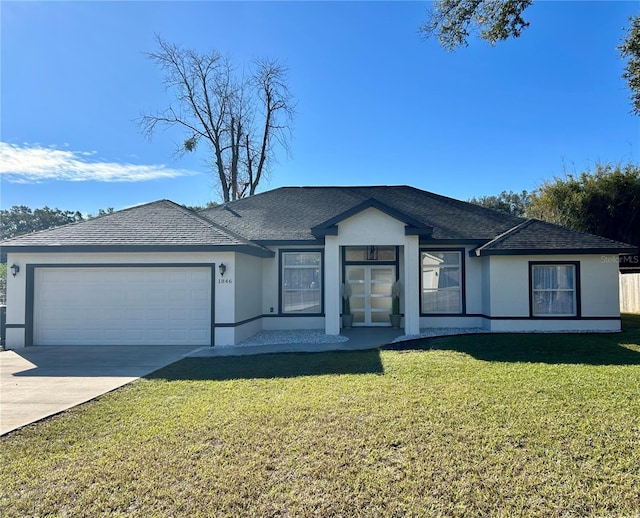 ranch-style house featuring a garage and a front yard