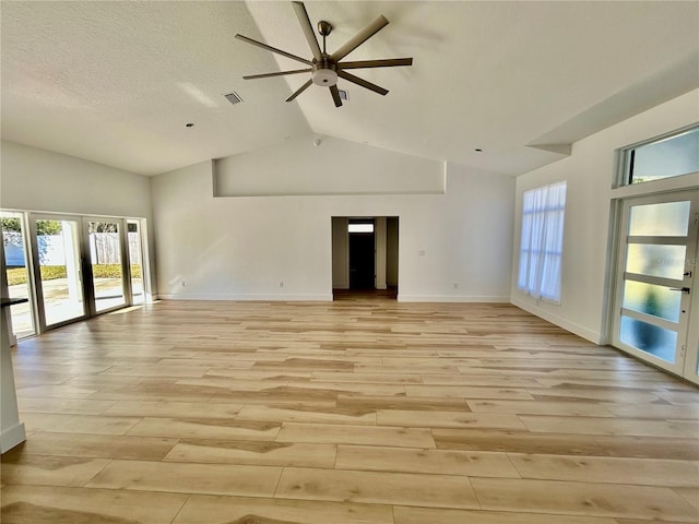 interior space with a wealth of natural light, light hardwood / wood-style flooring, french doors, and ceiling fan