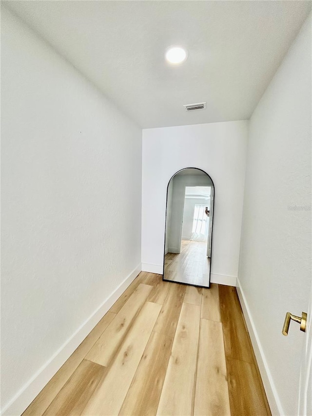 empty room with hardwood / wood-style floors