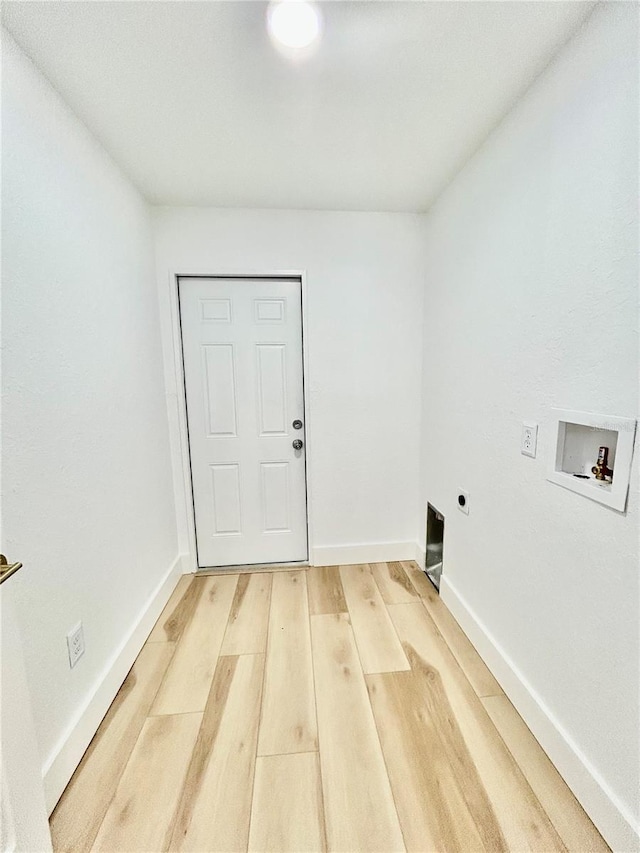 clothes washing area with washer hookup, wood-type flooring, and electric dryer hookup